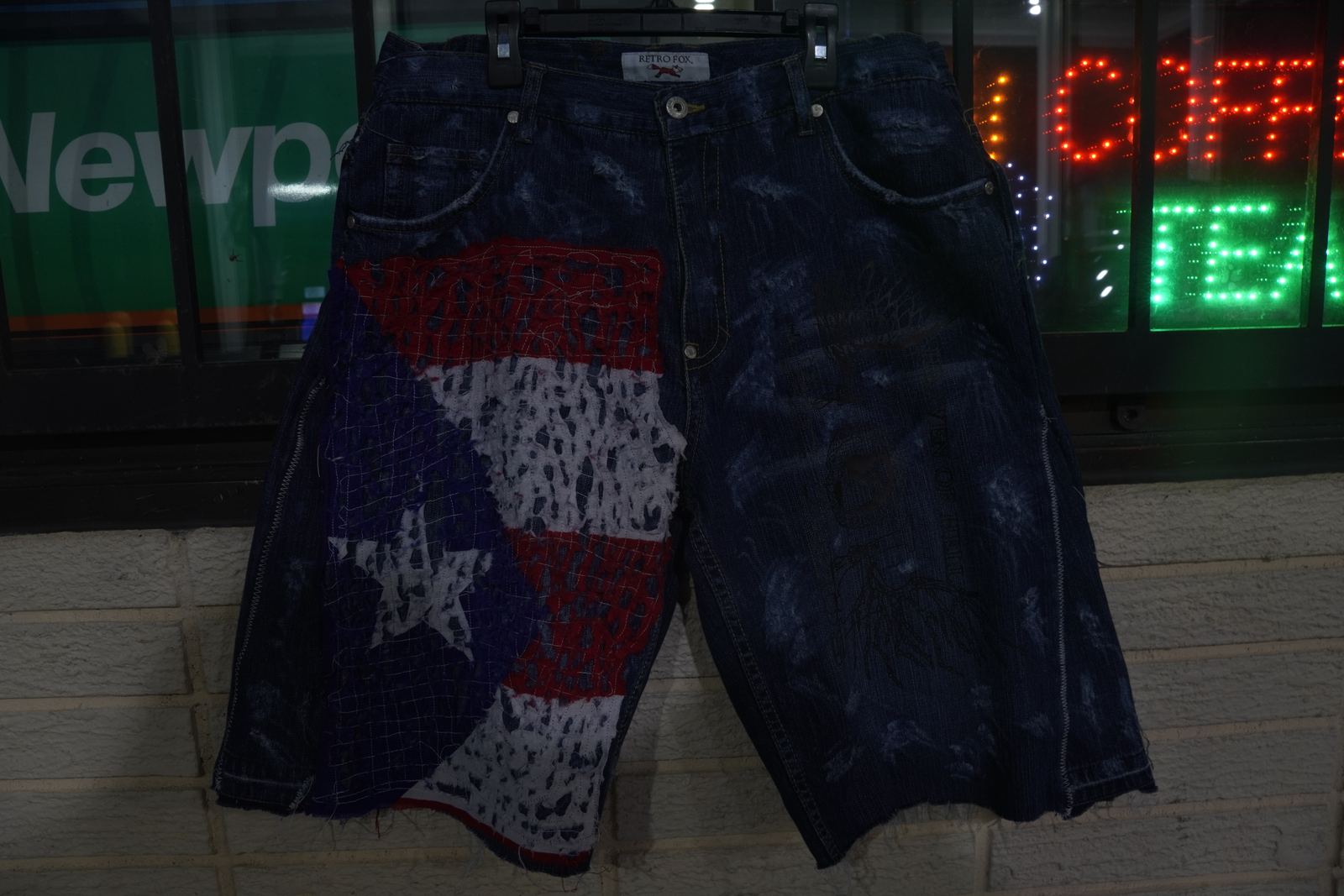 Hand-cut flag patchwork on custom denim