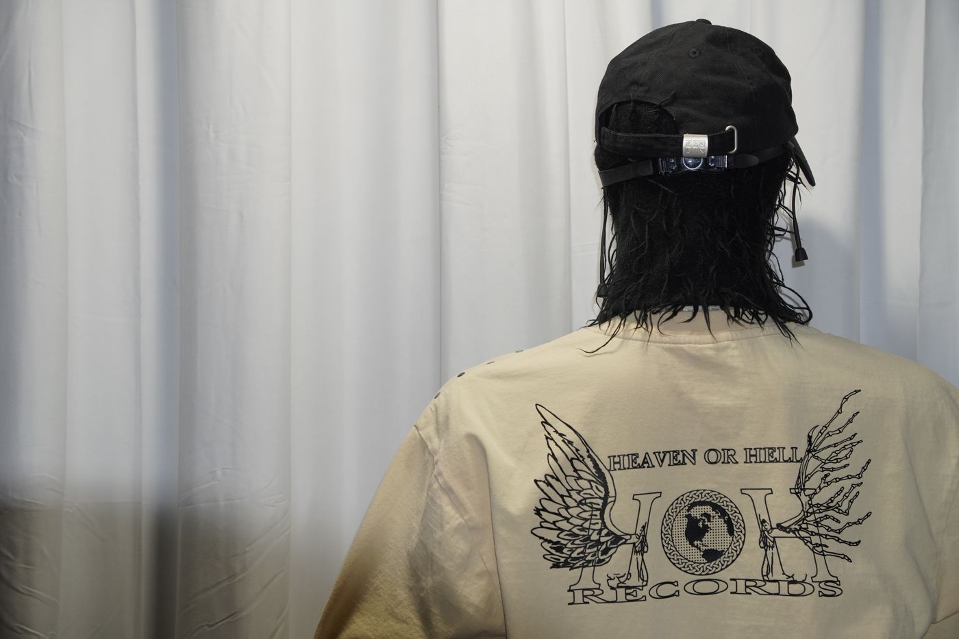 Cream long-sleeve tee with the Heaven or Hell Records wings and globe graphic on the back